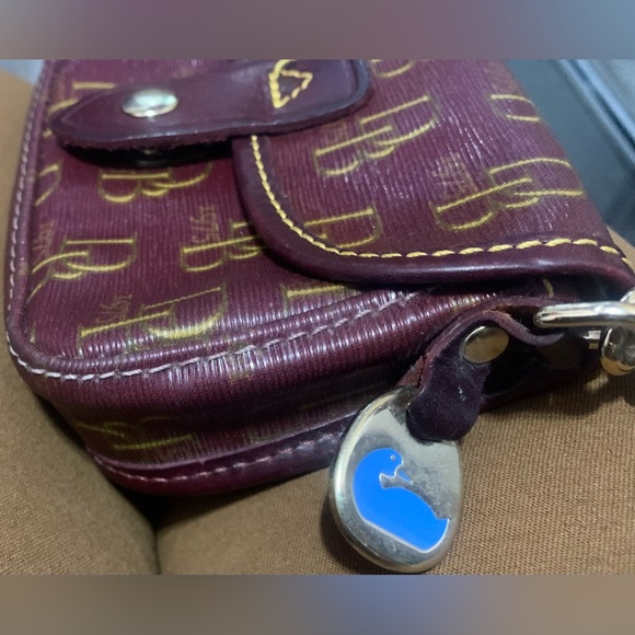 Dooney & Bourke Burgundy Signature
Leather & Canvas Flap Wristlet - Picture 4 of 8